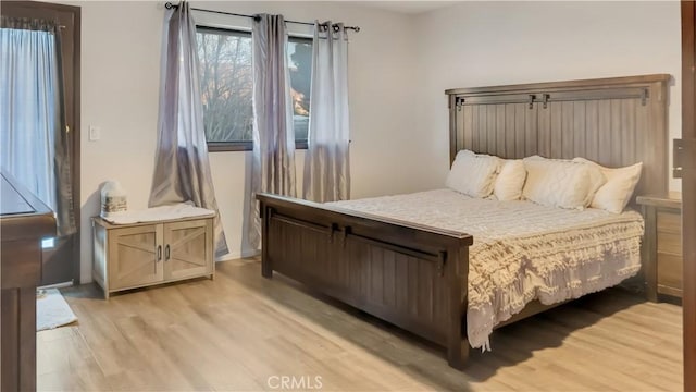 bedroom featuring light wood-style floors