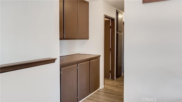 hallway with light wood finished floors