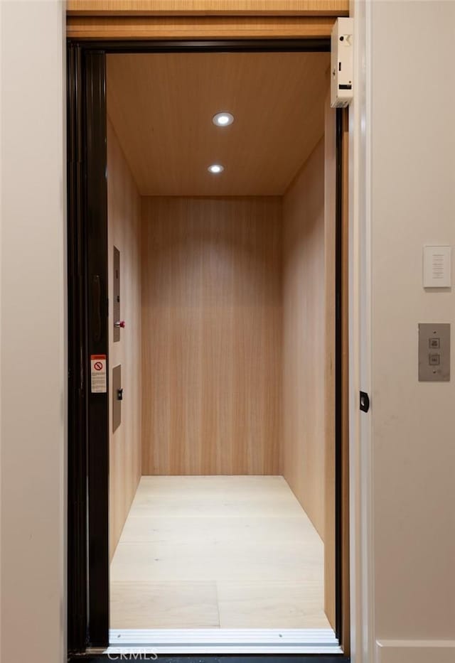 details featuring recessed lighting and elevator