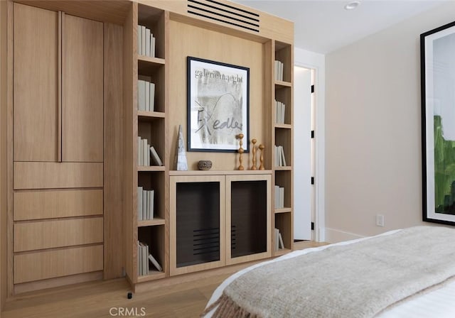 bedroom featuring light wood-style flooring