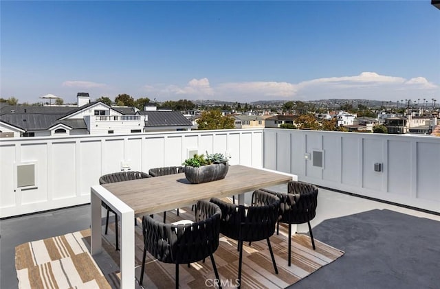 wooden deck featuring a patio and outdoor dining space