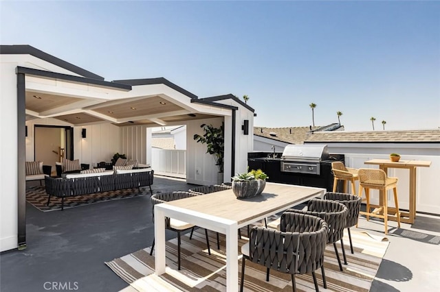 view of patio featuring outdoor dining area, grilling area, a sink, and an outdoor living space