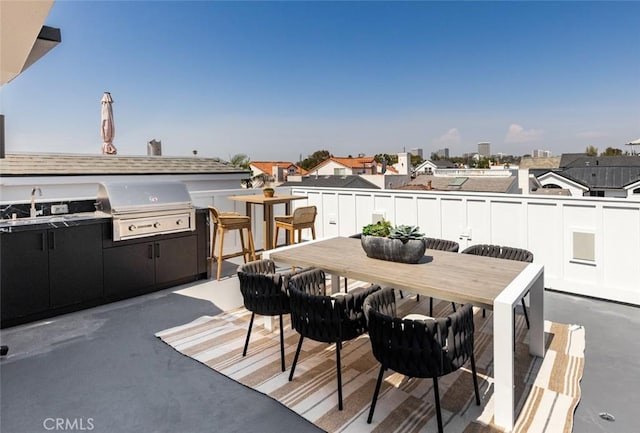 wooden terrace featuring a patio, outdoor dining area, and area for grilling