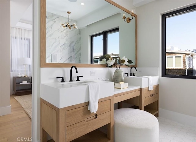 full bathroom featuring a chandelier, recessed lighting, vanity, and wood finished floors