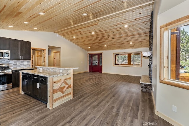 kitchen with wooden ceiling, vaulted ceiling, open floor plan, appliances with stainless steel finishes, and backsplash