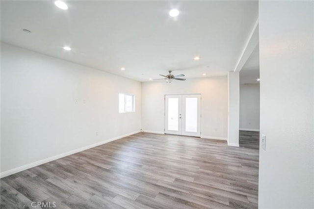 unfurnished room with french doors, wood finished floors, and recessed lighting