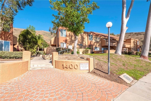 surrounding community featuring a mountain view