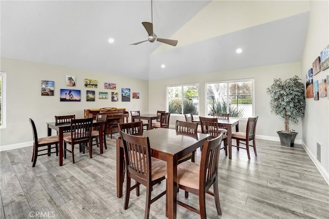 dining space with high vaulted ceiling, recessed lighting, visible vents, baseboards, and light wood-type flooring