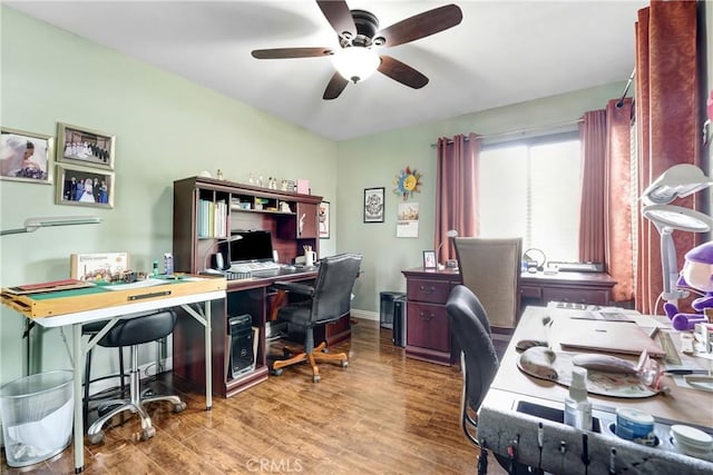 office featuring ceiling fan, baseboards, and wood finished floors