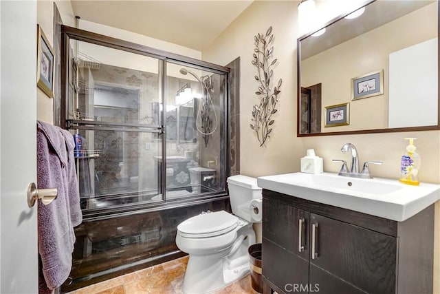 bathroom featuring shower / bath combination with glass door, vanity, and toilet