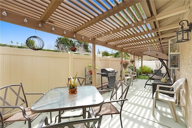 view of patio / terrace featuring a grill, a pergola, outdoor dining area, and fence