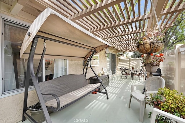 view of patio / terrace with outdoor dining space, a fenced backyard, and a pergola