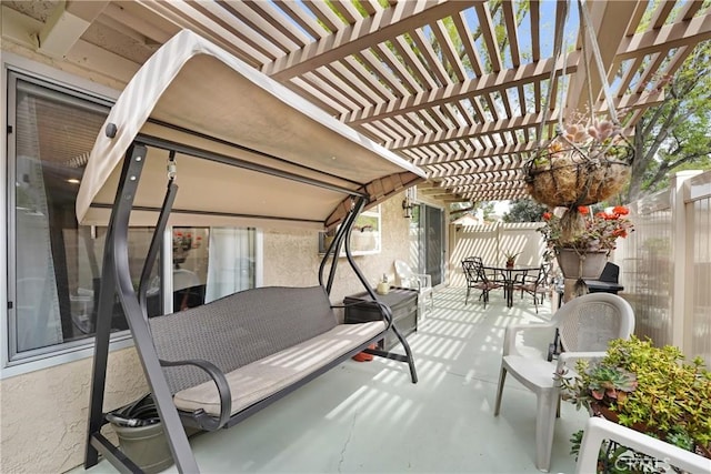 view of patio featuring fence private yard, outdoor dining area, and a pergola