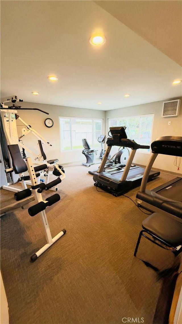 gym with recessed lighting, carpet, and a healthy amount of sunlight