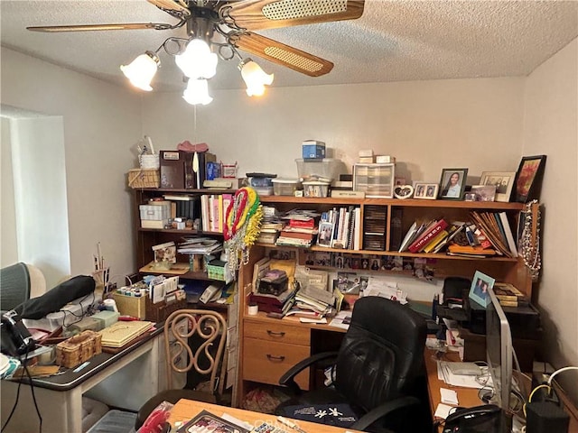 home office with a textured ceiling and a ceiling fan