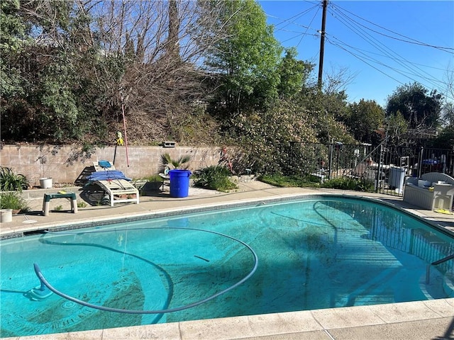 view of pool with a fenced backyard and a fenced in pool