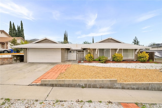 5635 Stanton Ave, Highland, CA 92346 - ranch-style home with a garage and driveway