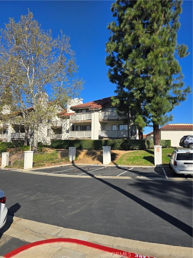 view of front of home featuring fence