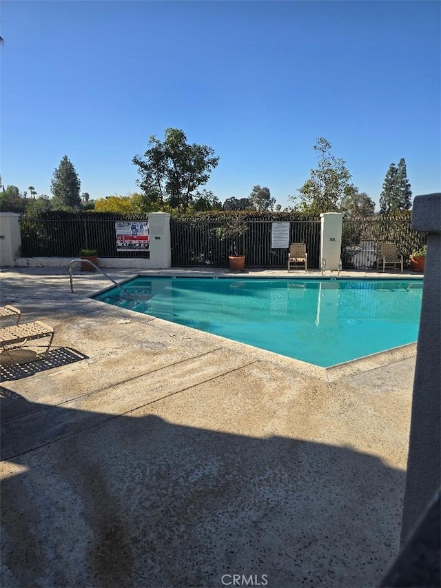 pool featuring fence