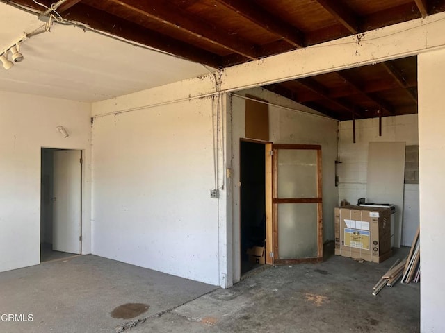 miscellaneous room with unfinished concrete flooring