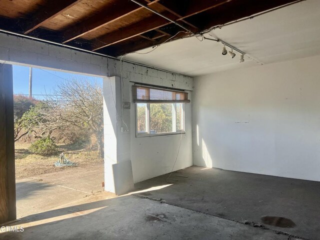 interior space featuring unfinished concrete floors