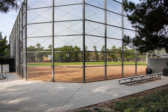 view of home's community featuring fence