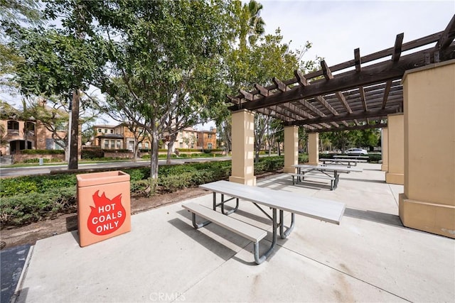 view of property's community featuring a patio and a pergola