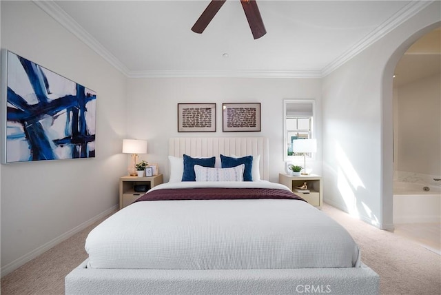 bedroom with arched walkways, baseboards, crown molding, and carpet