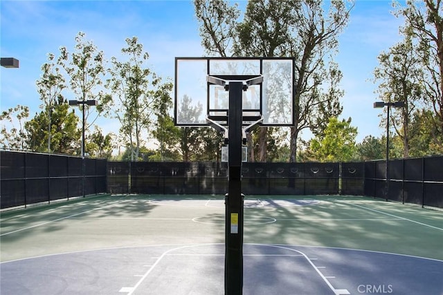 view of sport court with community basketball court and fence