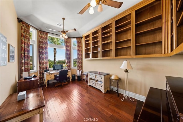 office featuring a ceiling fan, baseboards, visible vents, and dark wood-type flooring