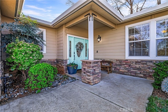 view of exterior entry with stone siding