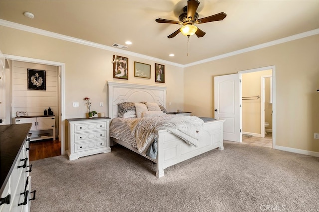 carpeted bedroom with recessed lighting, visible vents, ornamental molding, connected bathroom, and baseboards