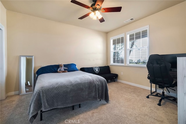 bedroom featuring a ceiling fan, carpet, visible vents, and baseboards