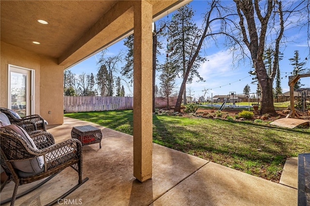 view of patio featuring fence