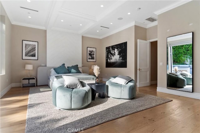 living room with light wood-style floors, visible vents, ornamental molding, and baseboards