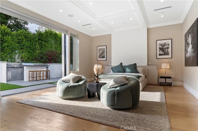 sitting room with recessed lighting, wood finished floors, baseboards, ornamental molding, and beamed ceiling