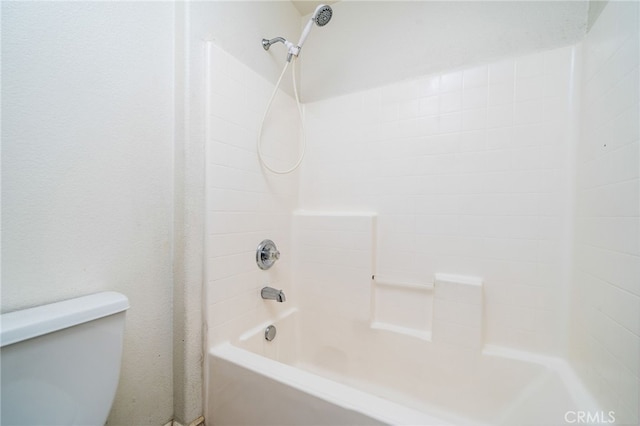 bathroom with shower / tub combination and toilet