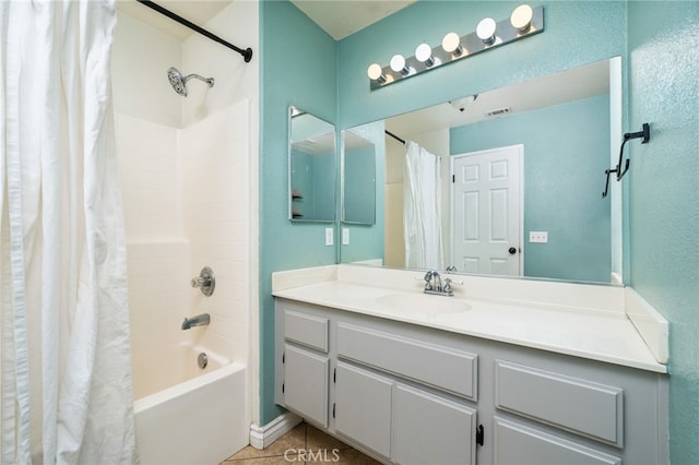 bathroom featuring shower / bath combo, vanity, visible vents, and tile patterned floors