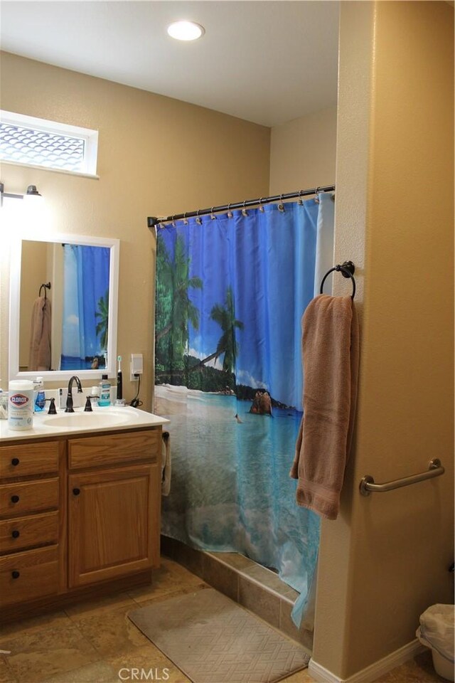 bathroom with a shower with curtain and vanity