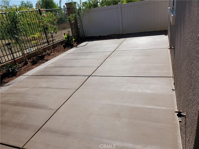 view of patio featuring fence