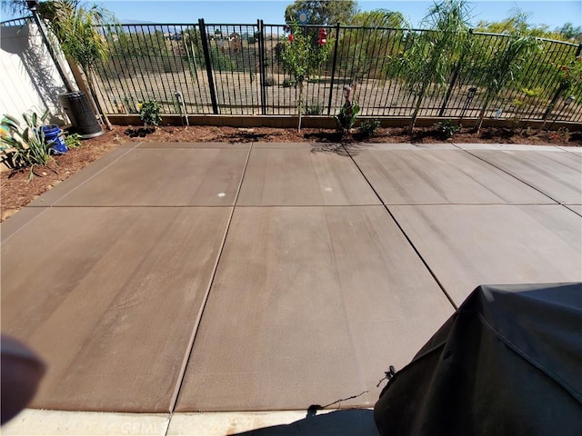 view of patio featuring fence