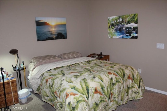bedroom featuring carpet and baseboards