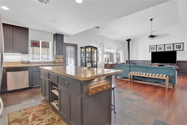 7575 Rancho Rd, Wrightwood, CA 92372 - kitchen featuring dishwasher, a ceiling fan, open floor plan, light stone countertops, and a center island