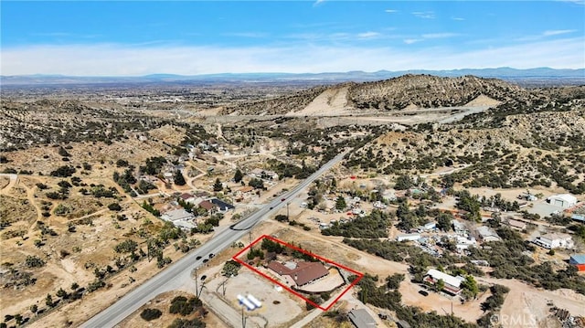 bird's eye view with a mountain view and a desert view