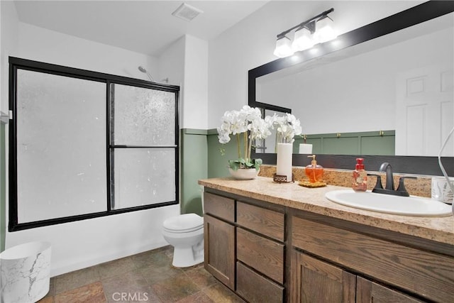 7575 Rancho Rd, Wrightwood, CA 92372 - full bathroom with vanity, enclosed tub / shower combo, and stone finish floors
