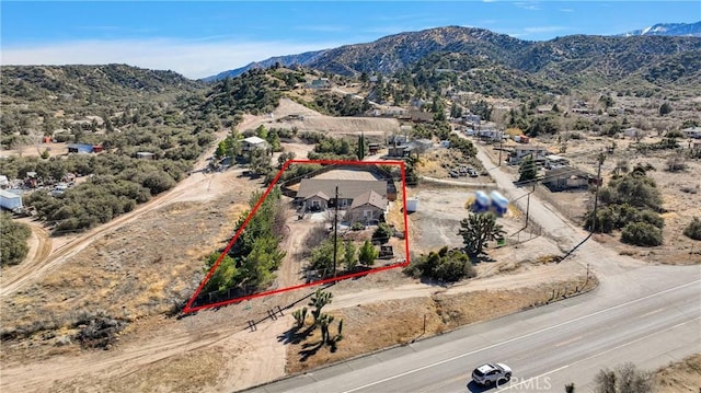 7575 Rancho Rd, Wrightwood, CA 92372 - aerial view of property's location featuring a mountain backdrop and property parcel outlined