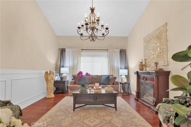 7575 Rancho Rd, Wrightwood, CA 92372 - living area featuring a chandelier, dark wood-style flooring, lofted ceiling, and a glass covered fireplace