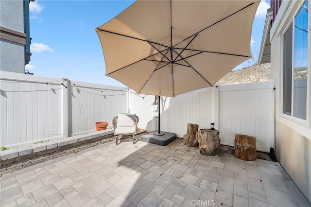 view of patio featuring a fenced backyard