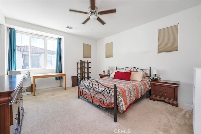 bedroom featuring carpet, visible vents, and a ceiling fan