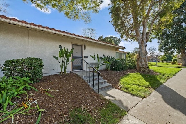 view of front of home featuring stucco siding